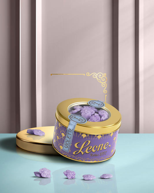 Latta tonda da 150 grammi di caramelle alla violetta Pastiglie Leone, coperchio dorato con finestra trasparente
