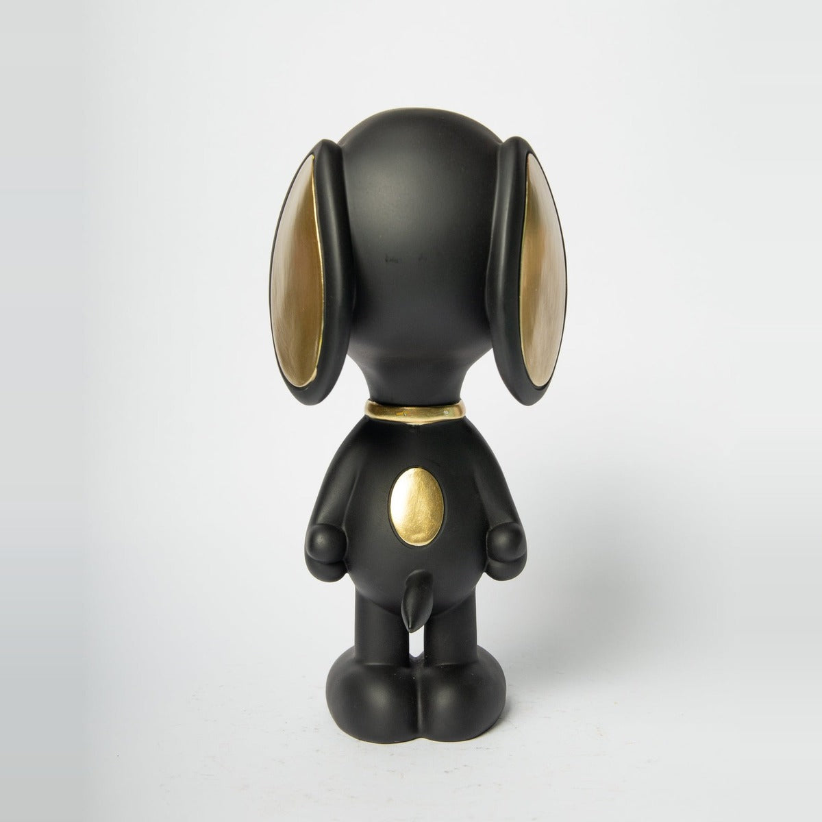 Statua Snoopy Standing Blogo Design nera e oro, vista da dietro